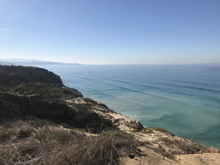 Dry headland and blue water