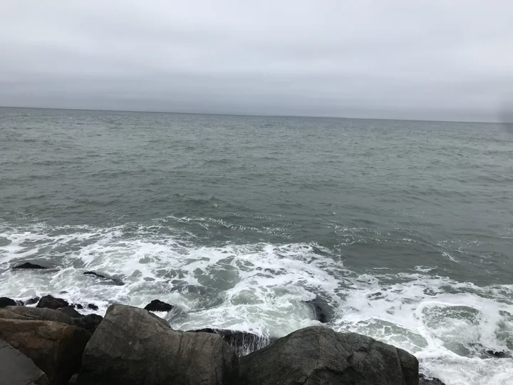 Grey sea and breaking water